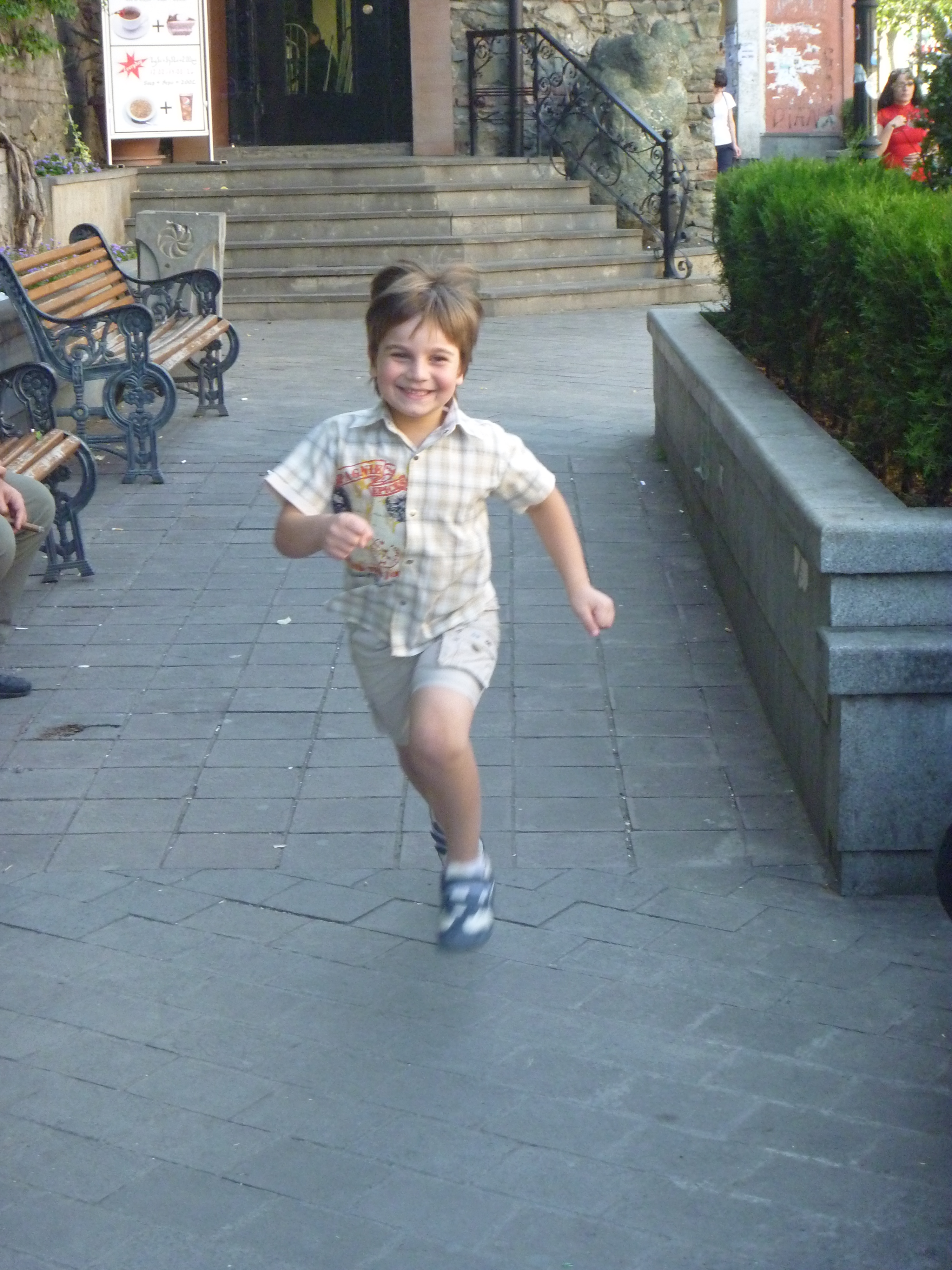 Levan Gelashvili as a child running and smiling in Tbilisi